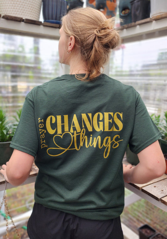 Christian Apparel shirt in army green stating, Prayer changes things