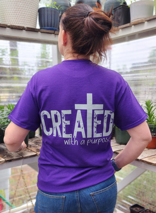 Purple Shirt with Created with a purpose written on it. The letter T transformed into a cross for biblical women clothes